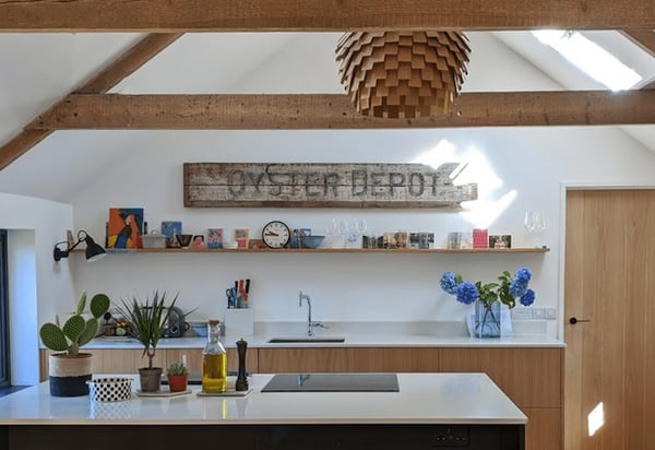 view towards kitchen over island with big oyster depot sign